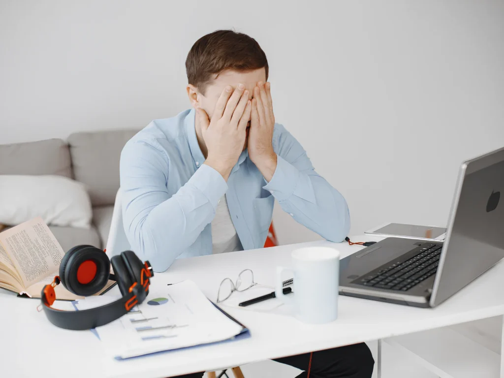 Image representing a frustrated business owner on the computer over poor SEO performance.