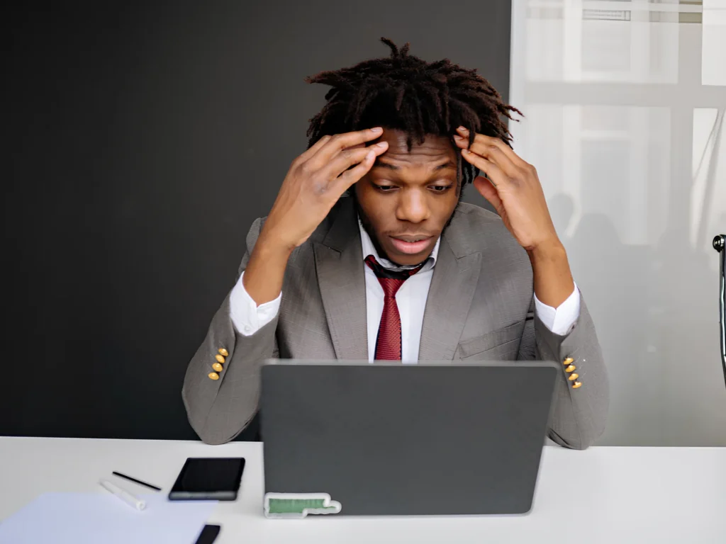 Image of a frustrated business owner upset about their ecommerce website.